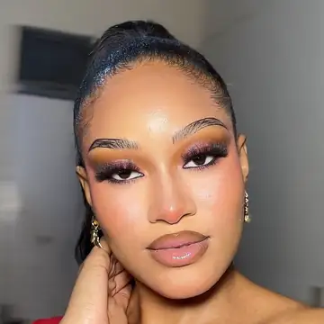 Dimma, the makeup artist behind Dimma Glam: a sleek high ponytail, sculpted brows and a soft nude lip